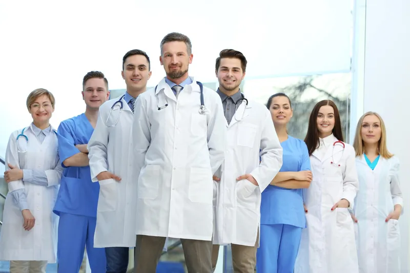 Smiling physicians and clinical staff from a group practice